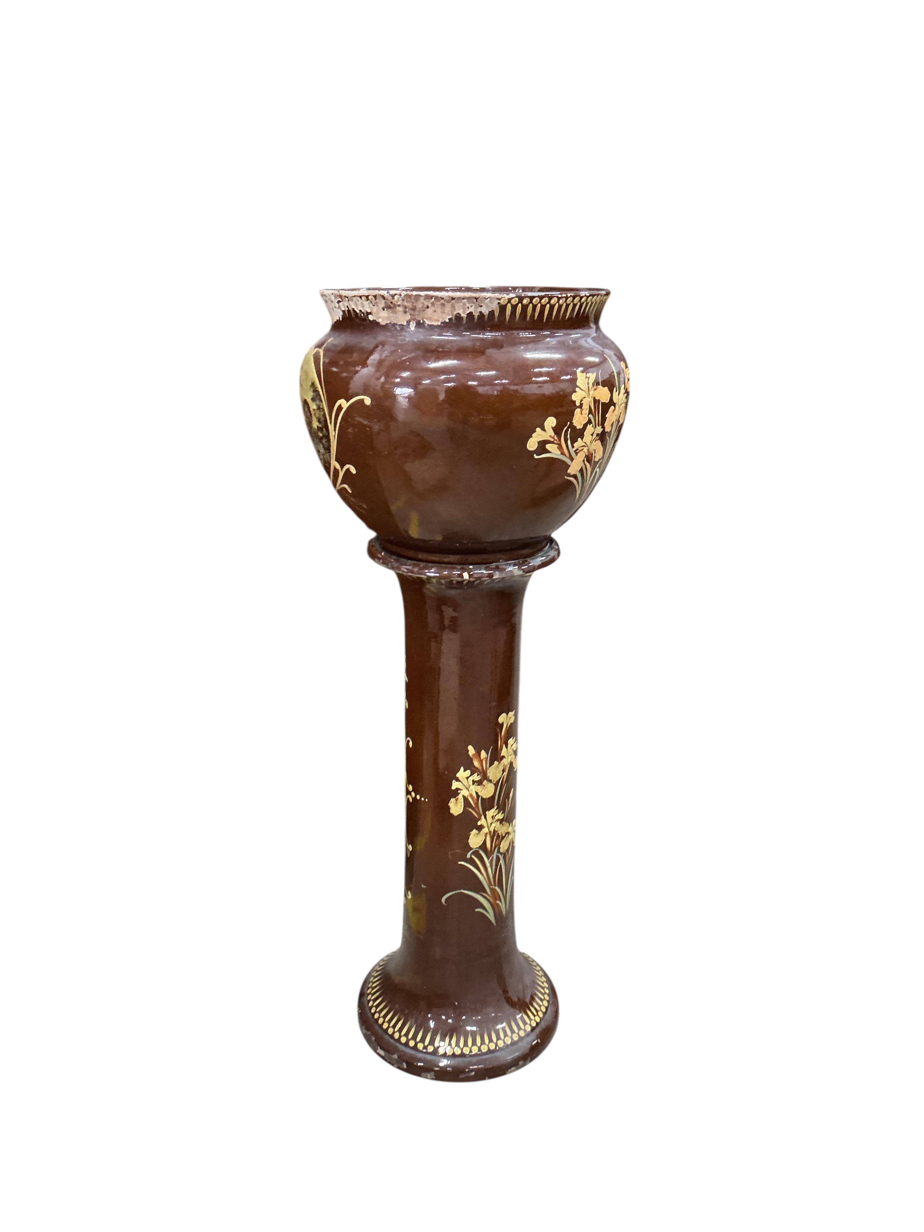 A Victorian glazed earthenware jardiniere on stand, diameter 44cm, height 108cm